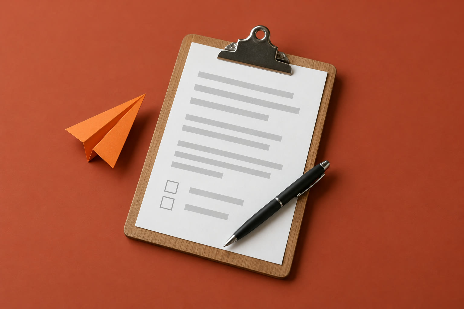 A clipboard with a form that has two empty checkboxes, and a pen